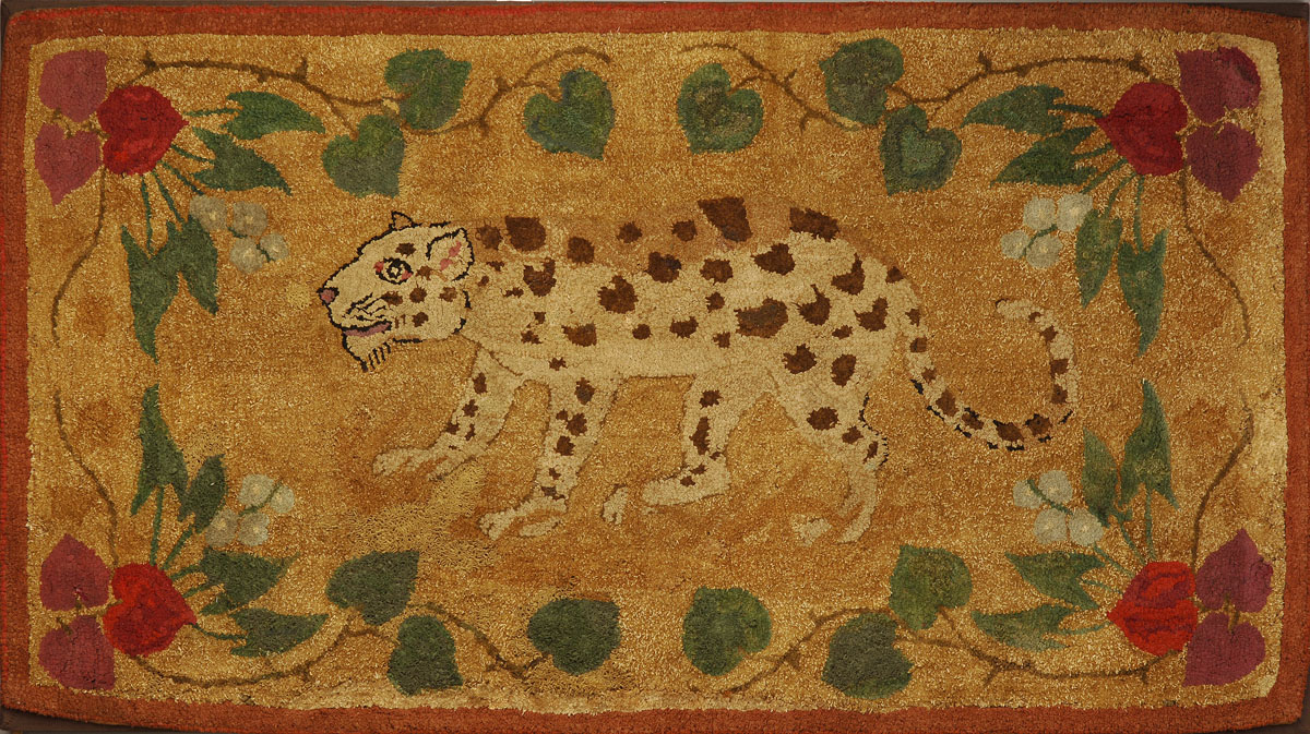 Appraisal: HOOKED RUG DEPICTING A LEOPARD WITHIN FLORAL AND FOLIATE BORDER