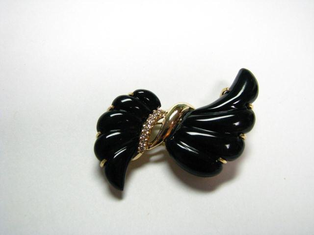 Appraisal: K yellow gold deco pin with black onyx and diamond