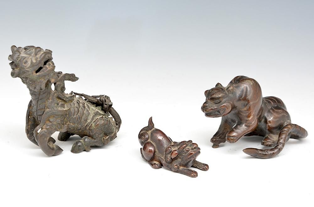 Appraisal: Bronze statues Foo dogs and a Qilin Kirin Bronze statues