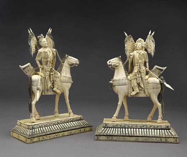 Appraisal: A pair of pieced and tinted male and female warriors