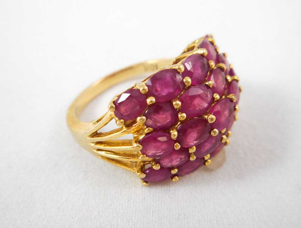 Appraisal: TEN KARAT GOLD AND RUBY RING having twenty three oval-cut