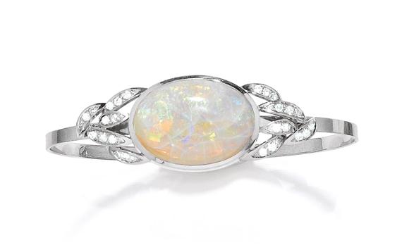 Appraisal: OPAL AND DIAMOND BANGLE White gold g Decorative bangle the