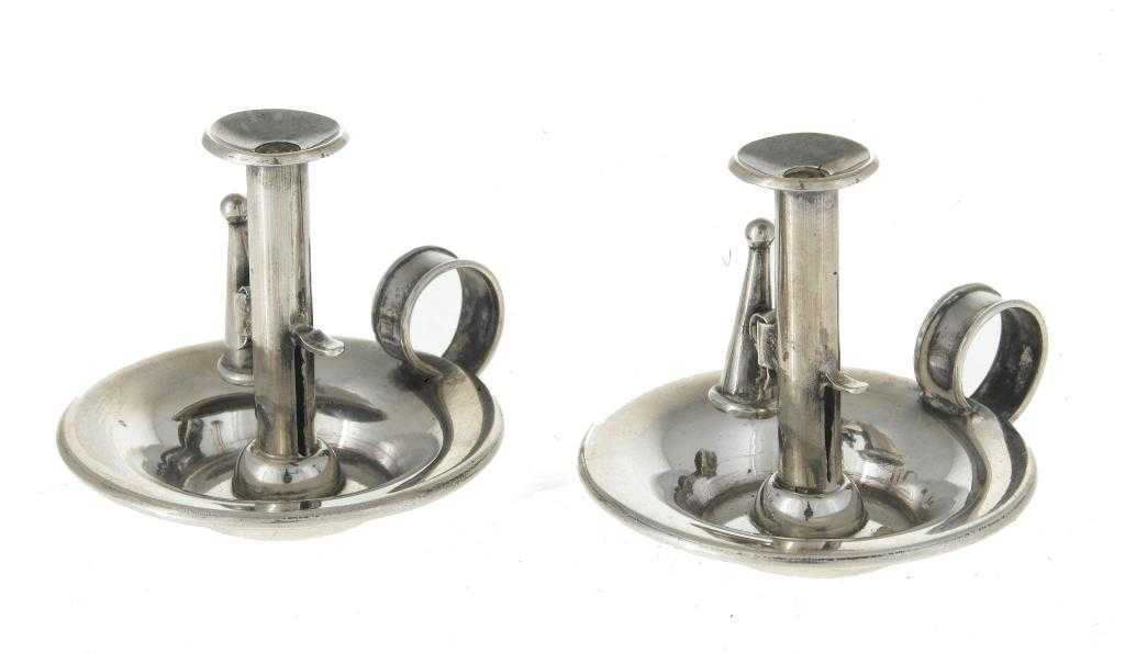 Appraisal: A PAIR OF VICTORIAN SILVER MINIATURE CHAMBER CANDLESTICKS with circular