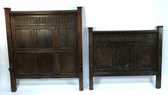 Appraisal: An oak bed head and foot board the top panel