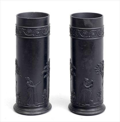 Appraisal: PAIR OF WEDGWOOD BLACK BASALT CYLINDRICAL VASESRelief-molded with classical muses