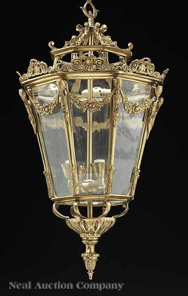 Appraisal: A Pair of Gilt Bronze and Glass Octagonal Four-Light Lanterns