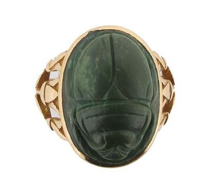 Appraisal: An Arts and Crafts style carved green hard stone scarab