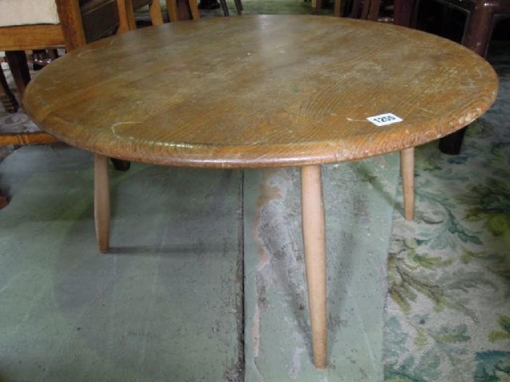 Appraisal: An Ercol elm and beechwood occasional table of circular form