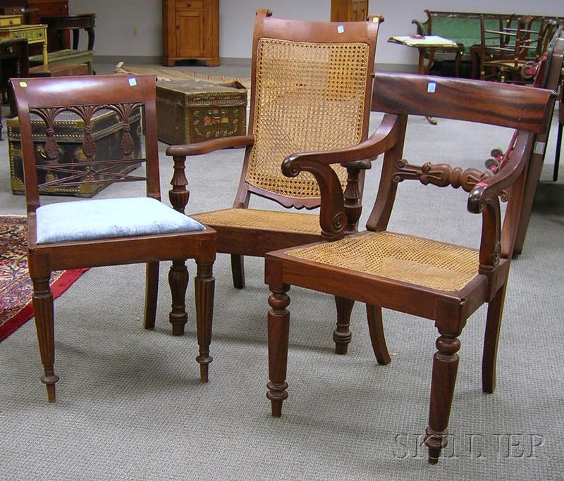 Appraisal: Three Chinese Classical Carved Mahogany Chairs an armchair with upholstered