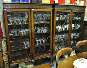 Appraisal: A pair of matched mahogany display cabinets bookcases each with