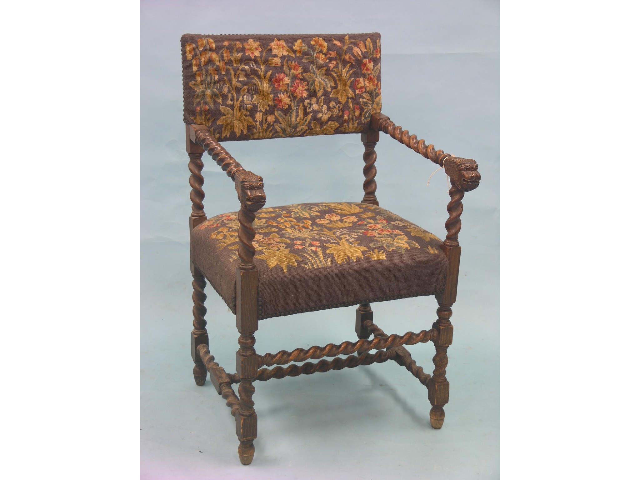 Appraisal: A Charles II-style walnut elbow chair with petit-point needlework seat