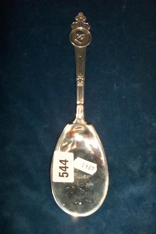 Appraisal: An outsized white metal spoon with stylised decoration monogrammed by