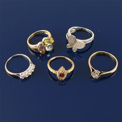 Appraisal: A gold ring set with cabochon stones Case A diamond