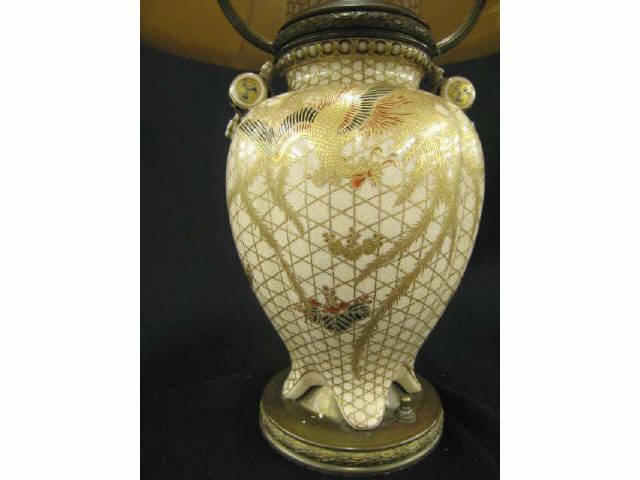 Appraisal: Japanese Satsuma Pottery Lamp flying phoenix design foo dog finial