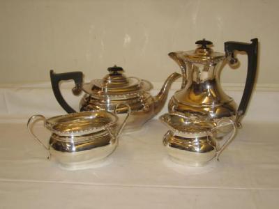 Appraisal: A FOUR PIECE TEA SERVICE the teapot of rounded oblong