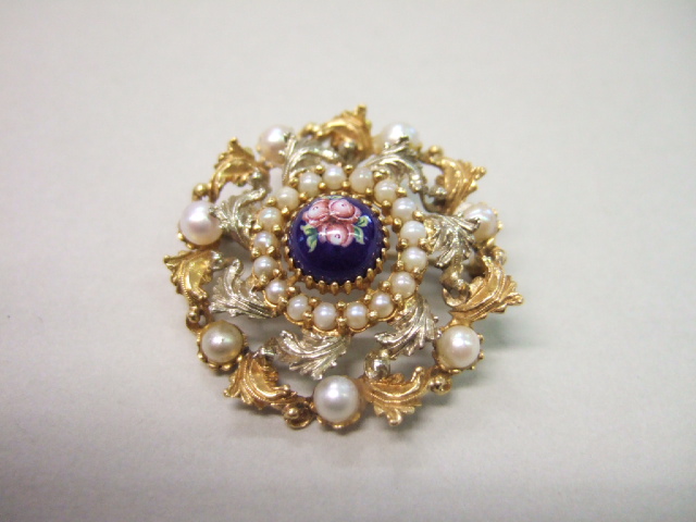 Appraisal: A gold cultured pearl and enameled pendant brooch the centre