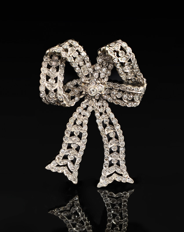 Appraisal: CTW DIAMOND BOW PENDANT K white gold ribbon and bow