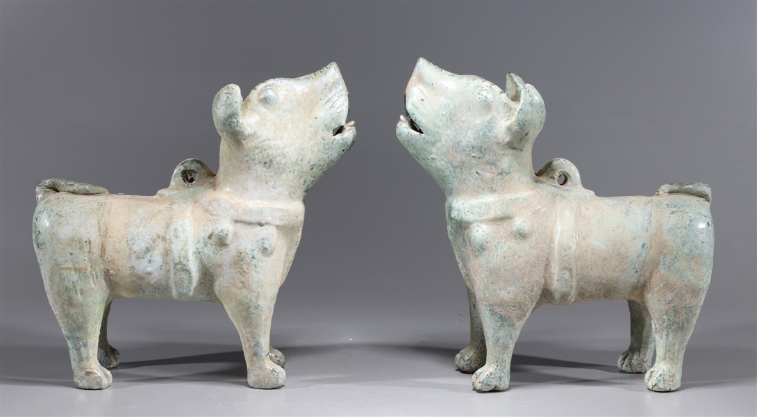 Appraisal: Two Chinese early style ceramic glazed dogs overall good condition