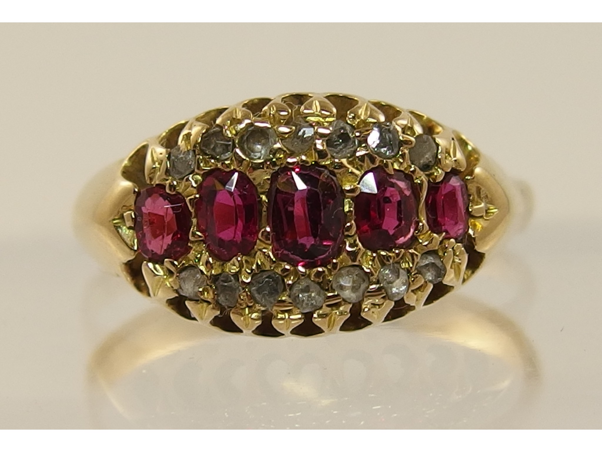 Appraisal: An ct Edwardian red gem stone and diamond ringwith pierced