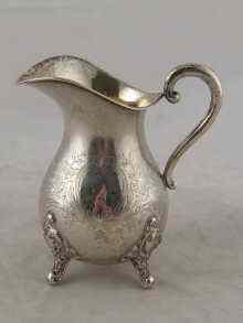 Appraisal: A white metal tests silver cream jug probably German approx