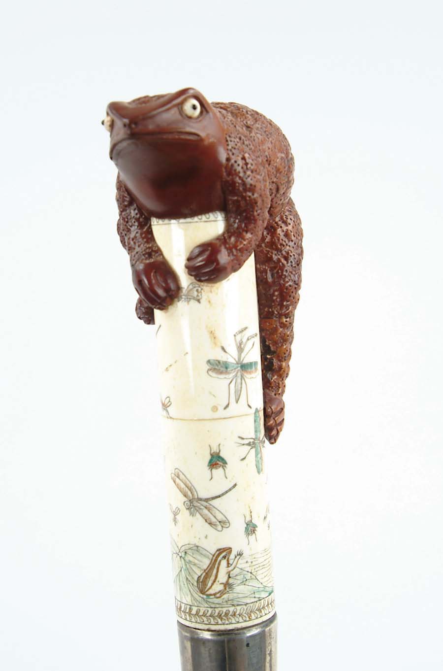 Appraisal: CANE CARVED WOOD FROG AND IVORY CANE A large brown