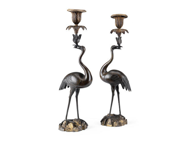 Appraisal: A pair of Victorian patinated and gilt bronze crane candelsticks