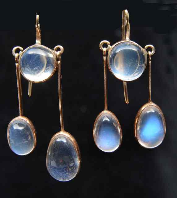 Appraisal: A PAIR OF MOONSTONE DROP EARRINGS central moonstone with a