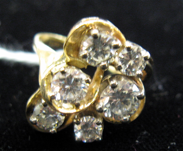 Appraisal: DIAMOND AND K GOLD RING set with six round brilliant-cut