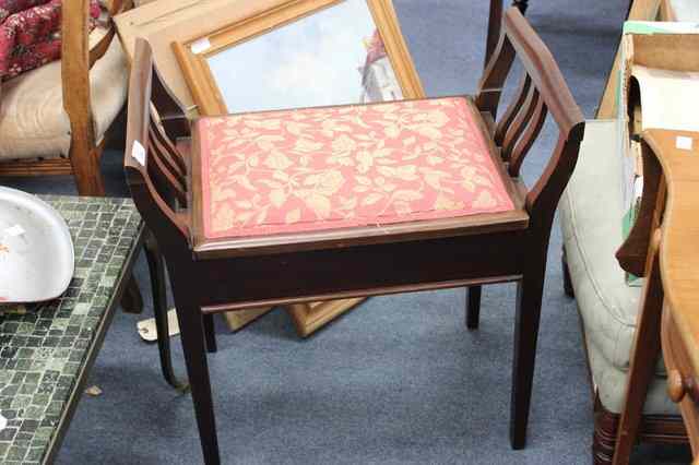 Appraisal: A MAHOGANY PIANO STOOL the seat with lifting lid and