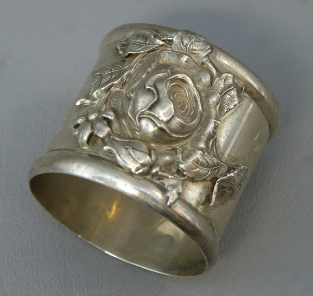 Appraisal: Whiting sterling silver napkin ring with raised rose design TO