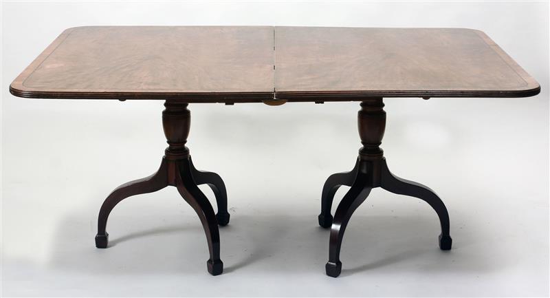 Appraisal: George III Style Mahogany Two-Pedestal Dining Table The divided top