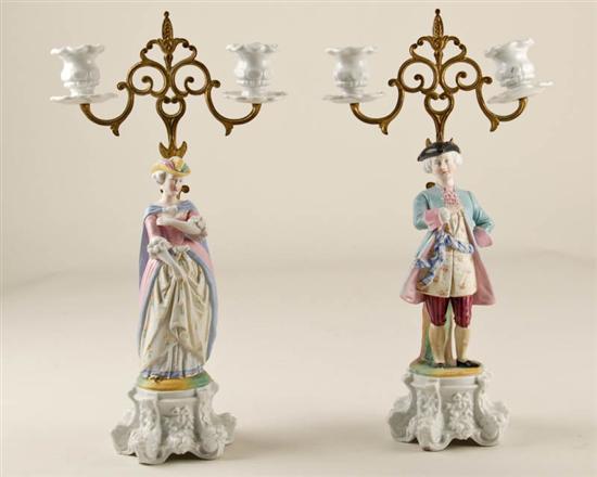 Appraisal: A Pair of Figural Porcelain Candelabra a man and a