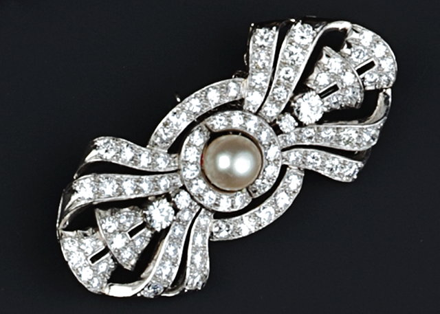 Appraisal: A CULTURED PEARL AND DIAMOND PANEL BROOCH designed as a