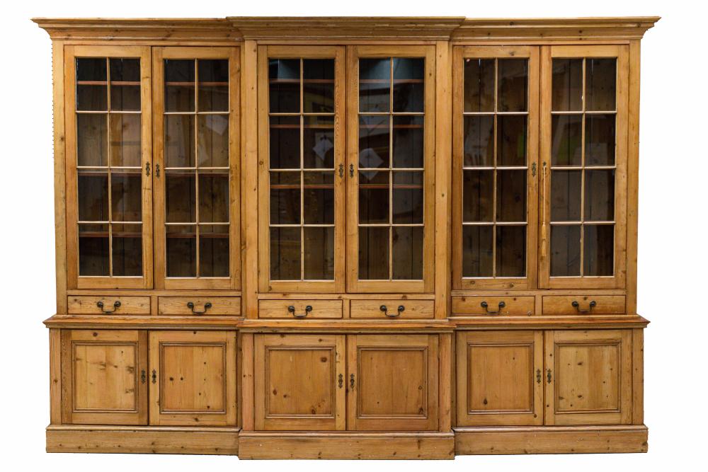 Appraisal: CONTINENTAL PINE BREAKFRONT BOOKCASEin three sections each having a pair