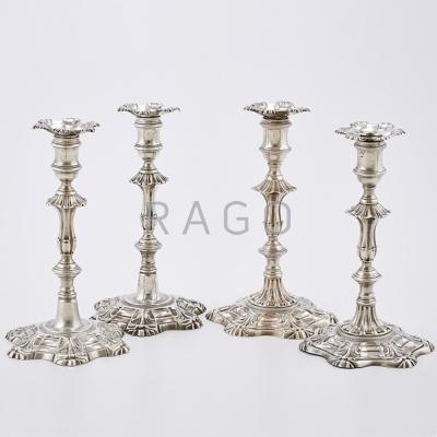 Appraisal: TWO PAIRS OF GEORGIAN CAST SILVER CANDLESTICKS Rococo style with