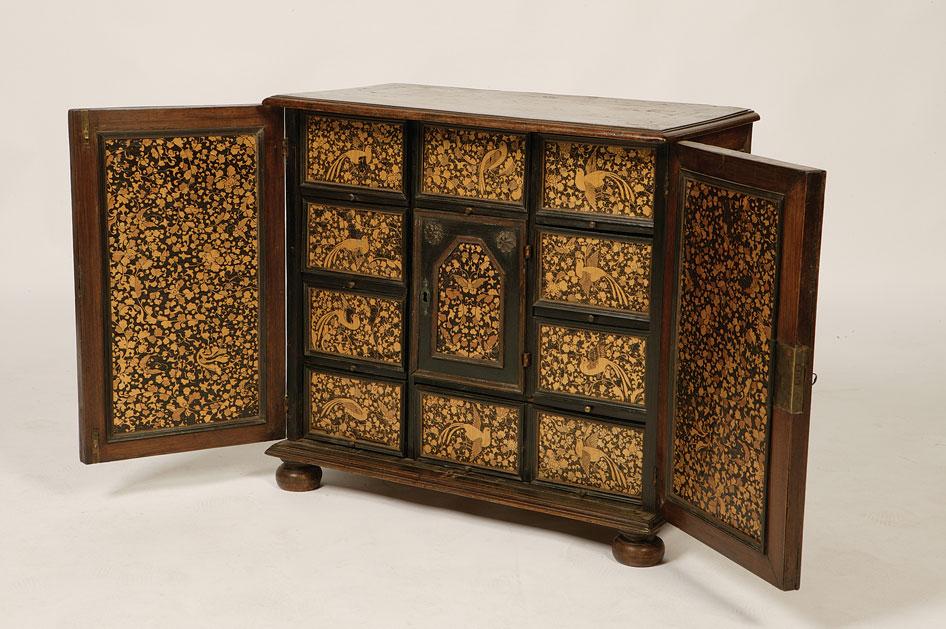 Appraisal: AN INDO-PORTUGESE HARDWOOD AND LACQUER CABINET the rectangular top with