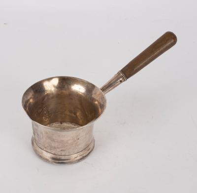 Appraisal: A Georgian silver brandy pan marks rubbed repaired and handle