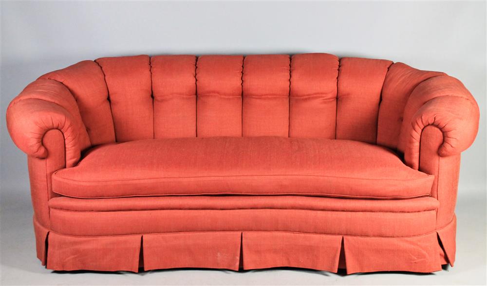 Appraisal: COCKEO BR INC CORAL UPHOLSTERED SOFA having a tufted back