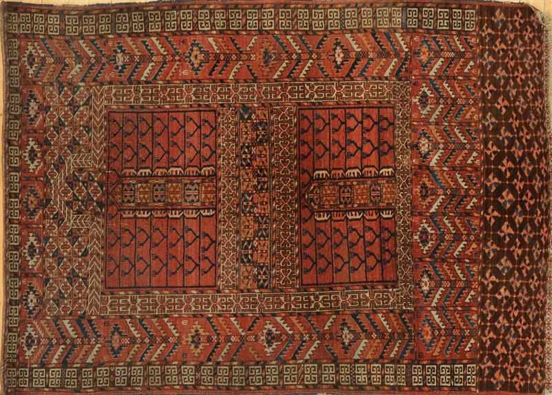 Appraisal: HATCHLI TURKOMAN RUG The wine-red field with four panels of