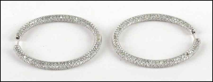 Appraisal: PAIR OF DIAMOND AND KARAT WHITE GOLD HOOP EARRINGS Round