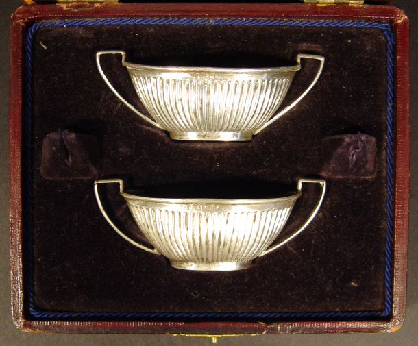 Appraisal: Pair of fluted silver salts in a velvet lined leather