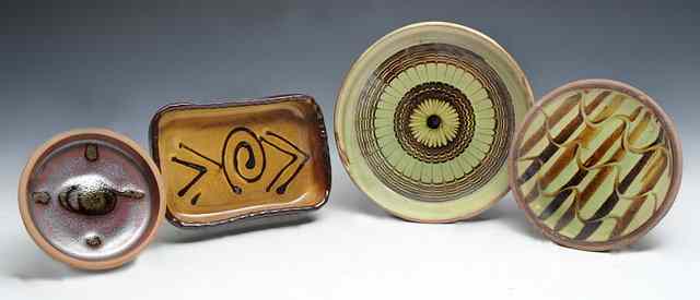 Appraisal: Sidney Tustin British - Two Winchcombe pottery dishes one with