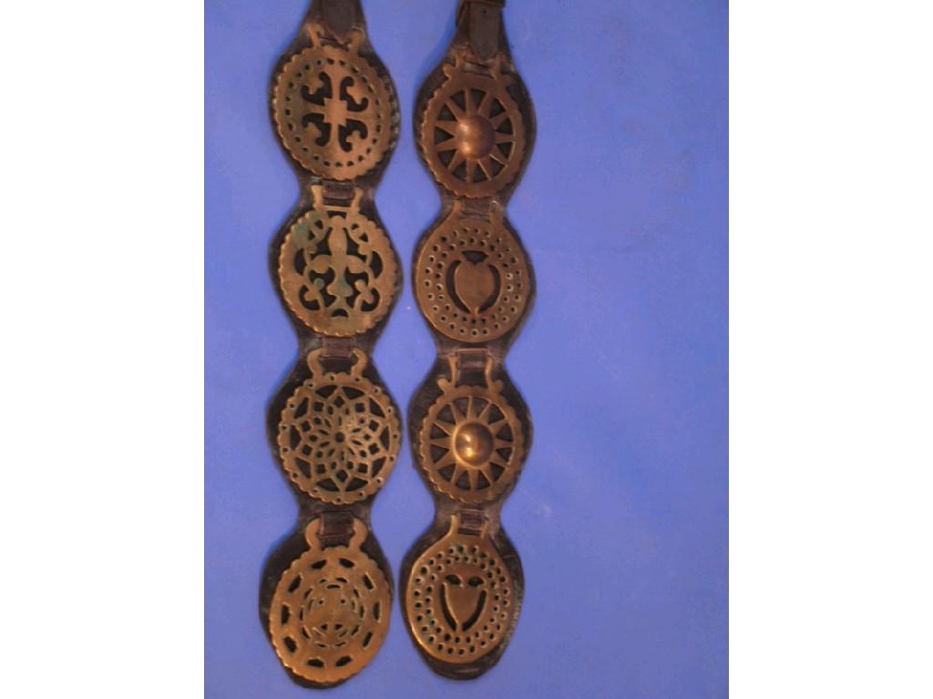 Appraisal: Two pierced four brass martingales