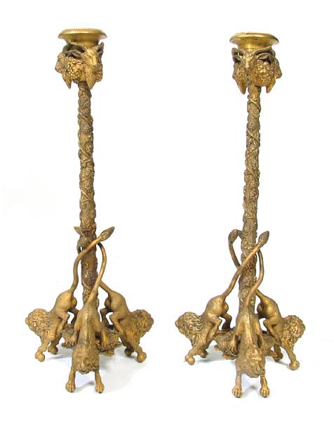 Appraisal: A pair of English bronze lion candlesticks height in width