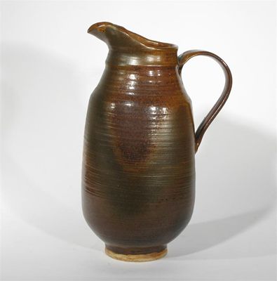 Appraisal: A tall Abdo Nagi stoneware jug covered in a mottled