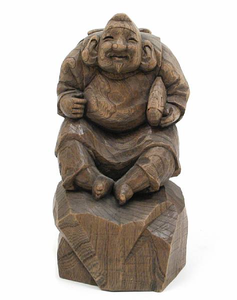 Appraisal: A Japanese wood carving of a Daikoku height in