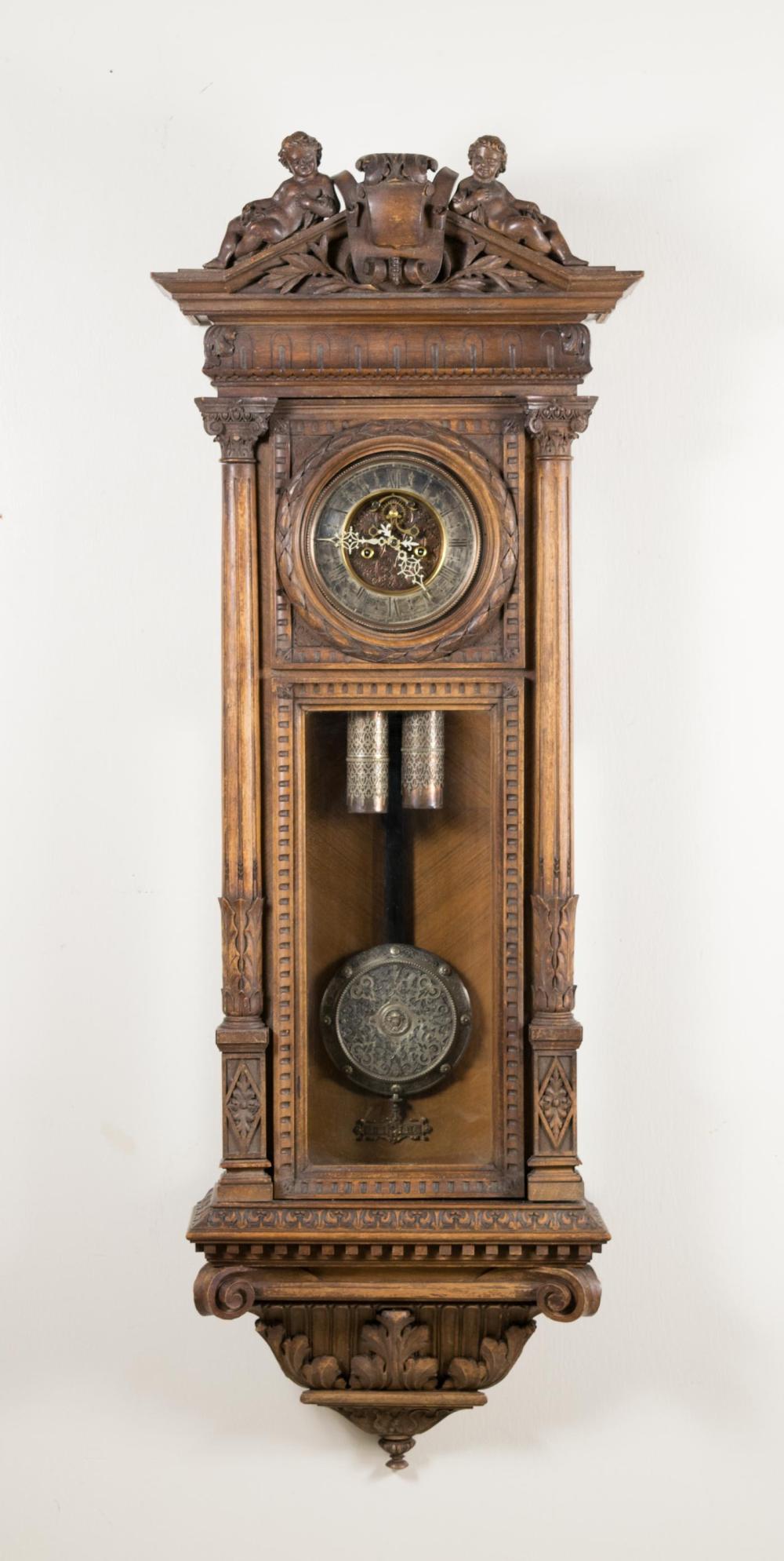 Appraisal: CARVED WALNUT LONG CASE REGULATOR WALL CLOCK Gustav Becker Clock