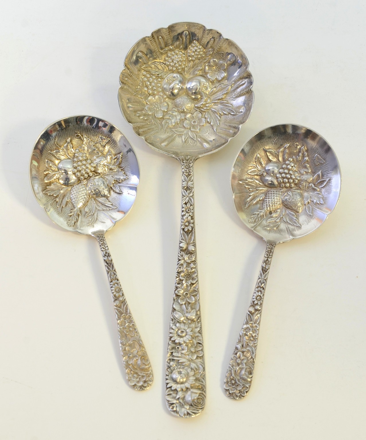 Appraisal: S Kirk Son Sterling Repousse berry spoons the smaller measure