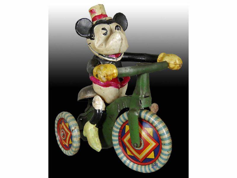 Appraisal: Walt Disney Celluloid Minnie Mouse on Tricycle Toy Description -