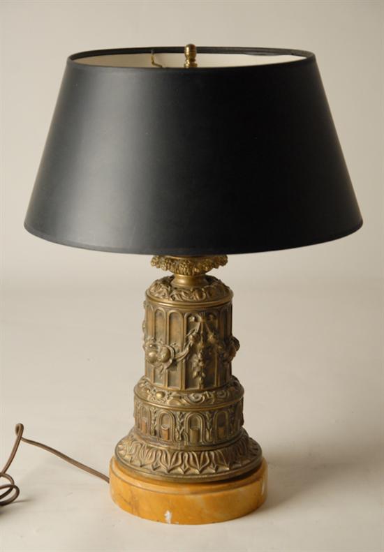 Appraisal: A Victorian Electrified Fluid Lamp pressed brass round column ornate